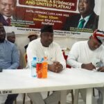 Caleb Mutfwang middle during reconciliatory meeting in Jos