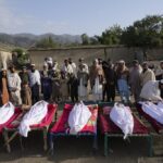 Men stand around the bodies of people killed in an earthquake in Gayan village, in Paktika province, Afghanistan, Thursday, June 23, 2022. A powerful earthquake struck a rugged, mountainous region of eastern Afghanistan early Wednesday, flattening stone and mud-brick homes in the country’s deadliest quake in two decades, the state-run news agency reported. (AP Photo/Ebrahim Nooroozi)