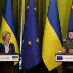 FILE – Ukraine President Volodymyr Zelenskyy speaks during a joint press conference with European Commission President Ursula von der Leyen, left, in Kyiv, Ukraine, Saturday, June 11, 2022. (AP Photo/Natacha Pisarenko, Filw)