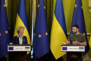 FILE – Ukraine President Volodymyr Zelenskyy speaks during a joint press conference with European Commission President Ursula von der Leyen, left, in Kyiv, Ukraine, Saturday, June 11, 2022. (AP Photo/Natacha Pisarenko, Filw)