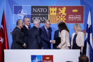 Turkish President Recep Tayyip Erdogan, center, shakes hands with Sweden’s Foreign Minister Ann Linde next to NATO Secretary General Jens Stoltenberg, second left, Finland’s President Sauli Niinisto, third right, and Sweden’s Prime Minister Magdalena Andersson, right, after signing a memorandum in which Turkey agrees to Finland and Sweden’s membership of the defense alliance in Madrid, Spain on Tuesday, June 28, 2022. North Atlantic Treaty Organization heads of state will meet for a summit in Madrid from Tuesday through Thursday. (AP Photo/Bernat Armangue)