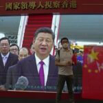 A visitor poses for a photograph in front of a TV showing Chinese president Xi Jinping at an exhibition to mark the 25th anniversary of the former British colony’s return to Chinese rule, in Hong Kong, Friday, June 24, 2022. Hong Kong authorities, citing “security reasons,” have barred more than 10 journalists from covering events and ceremonies this week marking the 25th anniversary of Hong Kong’s return to China, according to the Hong Kong Journalists Association. (AP Photo/Kin Cheung)