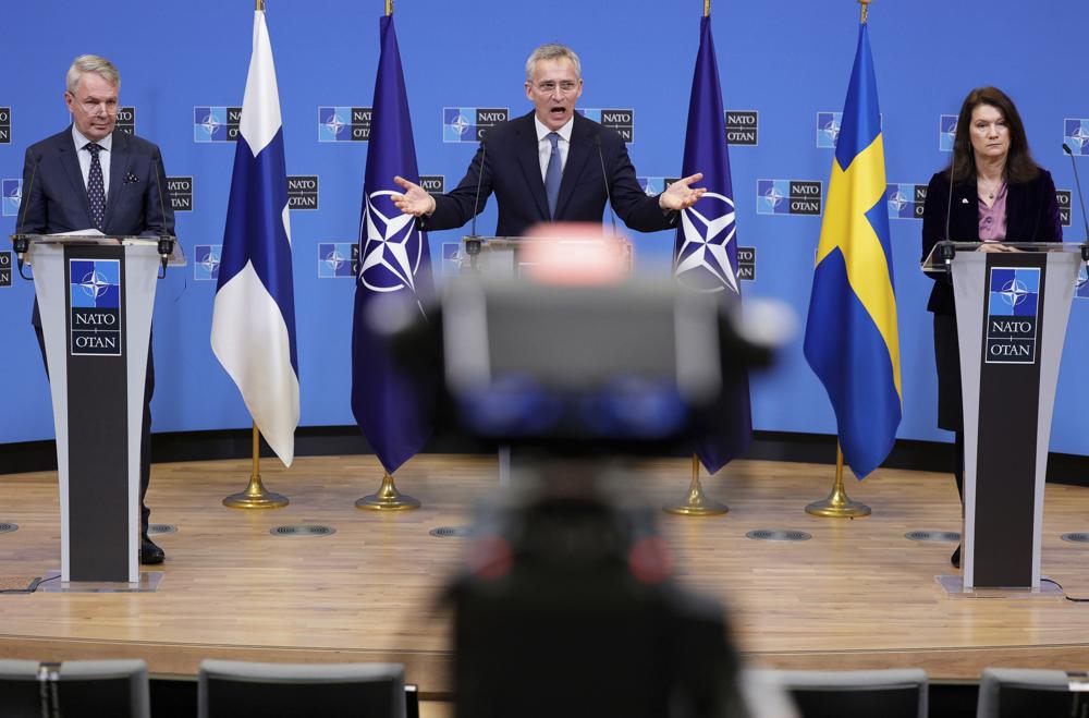 FILE – NATO Secretary General Jens Stoltenberg, center, participates in a media conference with Finland’s Foreign Minister Pekka Haavisto, left, and Sweden’s Foreign Minister Ann Linde, right, at NATO headquarters in Brussels, Monday, Jan. 24, 2022. (AP Photo/Olivier Matthys, File)