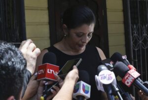Karen Caballero, the mother of Fernando Redondo Caballero and Alejandro Andino Caballero who died near San Antonio, Texas, after being discovered in a hot trailer full of migrants being smuggled into the US, speaks during an impromptu conference at their home in Las Vegas, Honduras, Wednesday, June 29, 2022. Caballero’s sons were among the bodies of 51 people discovered in what is believed to be the nation’s deadliest smuggling episode on the U.S.-Mexico border. (AP Photo/Delmer Martinez)