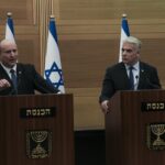 Israeli Prime Minister Naftali Bennett, left, speaks during a joint statement with Foreign Minister Yair Lapid, at the Knesset, Israel’s parliament, in Jerusalem, Monday, June 20, 2022. Bennett’s office announced Monday, that his weakened coalition will be disbanded and the country will head to new elections. Bennett and his main coalition partner, Yair Lapid, decided to present a vote to dissolve parliament in the coming days, Bennett’s office said. Lapid is then to serve as caretaker prime minister. The election, expected in the fall, would be Israel’s fifth in three years. (AP Photo/Maya Alleruzzo)