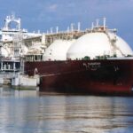 FILE – This undated file photo shows a Qatari liquid natural gas (LNG) tanker ship being loaded up with LNG, made up mainly of methane, at Raslaffans Sea Port, northern Qatar. The state-owned oil and gas company Qatar Energy said Monday, June 27, 2022, it is joining a new industry-led initiative to reduce nearly all methane emissions from operations by 2030. (AP Photo, File)