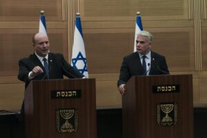 Israeli Prime Minister Naftali Bennett, left, speaks during a joint statement with Foreign Minister Yair Lapid, at the Knesset, Israel’s parliament, in Jerusalem, Monday, June 20, 2022. Bennett’s office announced Monday, that his weakened coalition will be disbanded and the country will head to new elections. Bennett and his main coalition partner, Yair Lapid, decided to present a vote to dissolve parliament in the coming days, Bennett’s office said. Lapid is then to serve as caretaker prime minister. The election, expected in the fall, would be Israel’s fifth in three years. (AP Photo/Maya Alleruzzo)
