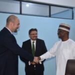 The Managing Director, News Agency of Nigeria (NAN), Mr Buki Ponle (right) in a handshake with the Ambassador of the Republic of Bulgaria to Nigeria, Mr Yanko Yordanov (left) as the Director-General, Bulgarian News Agency (BTA), Mr Kiril Valchev (middle) looks on during a working visit to the headquarters of NAN in Abuja.