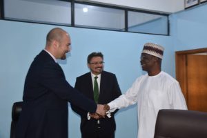 The Managing Director, News Agency of Nigeria (NAN), Mr Buki Ponle (right) in a handshake with the Ambassador of the Republic of Bulgaria to Nigeria, Mr Yanko Yordanov (left) as the Director-General, Bulgarian News Agency (BTA), Mr Kiril Valchev (middle) looks on during a working visit to the headquarters of NAN in Abuja.