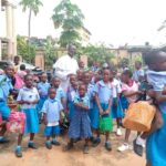 Rev.-Fr.-Augustine-Oburota-calming-down-some-of-the-traumatised-kids-at-Awada-school
