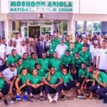 Golden Eaglets in a group photograph with Minister of Youth and Sports Development Sunday Dare and several other dignitaries after the reception in Abuja on Tuesday