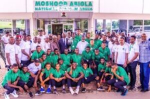 Golden Eaglets in a group photograph with Minister of Youth and Sports Development Sunday Dare and several other dignitaries after the reception in Abuja on Tuesday