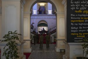 Police officers walk inside the official residence of President Gotabaya Rajapaksa in in Colombo, Sri Lanka, Thursday, July 14, 2022. With the country sinking into political chaos, Rajapaksa and his wife fled to the Maldives on Wednesday aboard an air force jet. He made the prime minister acting president in his absence — a move that further roiled passions among a public that blames Rajapaksa for an economic crisis that has caused severe shortages of food and fuel. (AP Photo/Rafiq Maqbool)