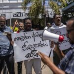 Trade union representatives and activists shout slogans during a protest against Sri Lanka’s acting president Ranil Wickremesinghe in Colombo, Sri Lanka, Monday, July 18, 2022. Wickremesinghe on Monday declared a state of emergency giving him broad authority amid growing protests demanding his resignation two days before the country’s lawmakers are set to elect a new president. (AP Photo/Rafiq Maqbool)