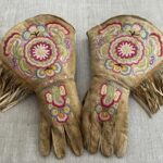 This undated photo provided on Wednesday, July 20, 2022, by Gregory Scofield, shows a pair of gauntlets he made in the late 19th-century Cree-Metif native Canadian traditional style. The Vatican’s Anima Mundi Ethnological Museum houses tens of thousands of artifacts and art made by Indigenous peoples from around the world. The restitution of Indigenous and colonial-era artifacts, a pressing debate for museums and national collections across Europe, is one of the many agenda items awaiting Francis on his trip to Canada, which begins Sunday. (Gregory Scofield via AP)