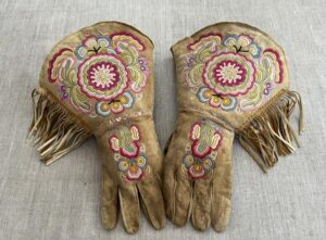 This undated photo provided on Wednesday, July 20, 2022, by Gregory Scofield, shows a pair of gauntlets he made in the late 19th-century Cree-Metif native Canadian traditional style. The Vatican’s Anima Mundi Ethnological Museum houses tens of thousands of artifacts and art made by Indigenous peoples from around the world. The restitution of Indigenous and colonial-era artifacts, a pressing debate for museums and national collections across Europe, is one of the many agenda items awaiting Francis on his trip to Canada, which begins Sunday. (Gregory Scofield via AP)