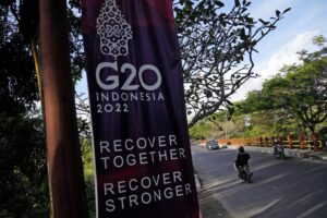 Motorists ride past a G20 banner in Nusa Dua, Bali, Indonesia, Thursday, July 7, 2022. Foreign ministers from the Group of 20 leading rich and developing nations are gathering in Indonesia’s resort island of Bali for talks bound to be dominated by the conflict in Ukraine despite an agenda focused on global cooperation and food and energy security. (AP Photo/Dita Alangkara)