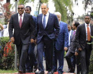 FILE – Russian Foreign Minister Sergey Lavrov, center, walks with Ethiopian Deputy Prime Minister Demeke Mekonnen, left, as they visit the compound of the Russian Embassy in Addis Ababa, Ethiopia, July 27, 2022. Russian, French and American leaders are crisscrossing Africa to win support for their positions on the war in Ukraine, an intense competition for influence the continent has not seen since the Cold War. (AP Photo, File)