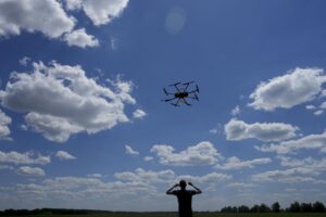 Oleg flies a drone while testing it on the outskirts of Kyiv, Ukraine, Wednesday, June 8, 2022. Never in the history of warfare have drones been used as intensively as in Ukraine, where they often play an outsized role in who lives and dies. Russians and Ukrainians alike depend heavily on unmanned aerial vehicles to pinpoint enemy positions and guide their hellish artillery strikes. (AP Photo/Natacha Pisarenko)
