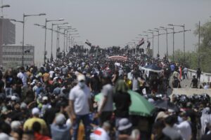 Protesters gather a bridge leading to the Green Zone area in Baghdad, Iraq, Saturday, July 30, 2022 — days after hundreds breached Baghdad’s parliament Wednesday chanting anti-Iran curses in a demonstration against a nominee for prime minister by Iran-backed parties.(AP Photo/Anmar Khalil)