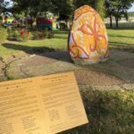A view of a 2014 stone with runic inscription in memory of Danish 10th century King Harald “Bluetooth” Gormsson, in Wolin, Poland, Saturday, July 30,2022. More than 1,000 years after his death in what is now Poland, a Danish king whose nickname is known to the world through the Bluetooth technology is at the center of an archeological dispute. A Polish researcher and a Swedish archeologist claim that they have pinpointed the probable burial site for King Harald Bluetooth Gormsson in a small village in northwestern Poland, an area that once had ties with the Vikings. (AP Photo Monika Scislowska)