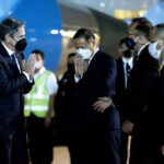 US Secretary of State Antony Blinken is greeted by Michael Health, Charge d’ Affaires a.i. of the US Mission in Thailand, and Chettaphan Maksamphan, MFA DG American and South Pacific Affairs, upon his arrival at Bangkok Don Mueang International Airport in Bangkok, Thailand, Saturday, July 9, 2022. (Stefani Reynolds, Pool Photo via AP)