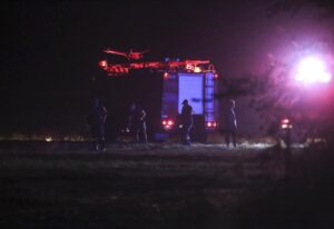 Firefighters are seen near the site of a plane crash, a few miles away from the city of Kavala, in northern Greece, Saturday, July 16, 2022. An Antonov cargo plane operated by a Ukraine-based air carrier crashed Saturday near the city of Kavala in northern Greece, authorities said. Greek Civil Aviation authorities say the flight was heading from Serbia to Jordan, but have not been able to confirm how many people were on board or what the plane’s cargo was. (Ilias Kotsireas/InTime News via AP)