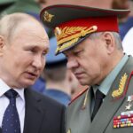 FILE – Russian President Vladimir Putin speaks with Russian Defence Minister Sergei Shoigu during a wreath laying ceremony at the Tomb of Unknown Soldier in Moscow, Russia, Wednesday, June 22, 2022, marking the 81st anniversary of the Nazi invasion of the Soviet Union. Defense Minister Sergei Shoigu told President Vladimir Putin that Russia’s troops together with members of a local separatist militia “have established full control over the city of Lysychansk,” a ministry statement said Sunday, July 3, 2022. (Mikhail Metzel, Sputnik, Kremlin Pool Photo via AP, File)