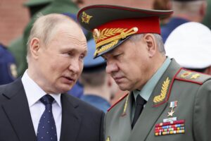 FILE – Russian President Vladimir Putin speaks with Russian Defence Minister Sergei Shoigu during a wreath laying ceremony at the Tomb of Unknown Soldier in Moscow, Russia, Wednesday, June 22, 2022, marking the 81st anniversary of the Nazi invasion of the Soviet Union. Defense Minister Sergei Shoigu told President Vladimir Putin that Russia’s troops together with members of a local separatist militia “have established full control over the city of Lysychansk,” a ministry statement said Sunday, July 3, 2022. (Mikhail Metzel, Sputnik, Kremlin Pool Photo via AP, File)