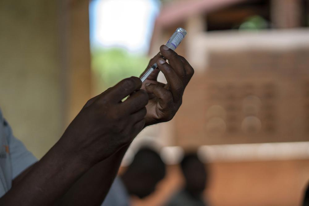 FILE – Health officials prepare to administer a vaccine in the Malawi village of Tomali with the world’s first vaccine against malaria in a pilot program in Tomali, Dec. 11, 2019. As the World Health Organization announces Thursday July 21, 2022 the next step in its rollout of the world’s first authorized malaria vaccine in several African countries, the Bill and Melinda Gates Foundation says it will no longer financially support the shot. (AP Photo/Jerome Delay, File)