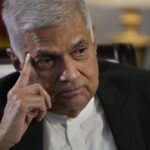 FILE – Sri Lanka’s new Prime Minister Ranil Wickremesinghe gestures during an interview with The Associated Press in Colombo, Sri Lanka, Saturday, June 11, 2022. Sri Lanka’s prime minister and acting president, Wickremesinghe, will face two rivals in a parliamentary vote Wednesday, July 20, on who will succeed the ousted leader who fled the country last week amid huge protests triggered by its economic collapse. (AP Photo/Eranga Jayawardena, File)