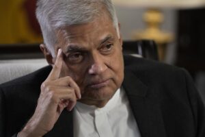 FILE – Sri Lanka’s new Prime Minister Ranil Wickremesinghe gestures during an interview with The Associated Press in Colombo, Sri Lanka, Saturday, June 11, 2022. Sri Lanka’s prime minister and acting president, Wickremesinghe, will face two rivals in a parliamentary vote Wednesday, July 20, on who will succeed the ousted leader who fled the country last week amid huge protests triggered by its economic collapse. (AP Photo/Eranga Jayawardena, File)