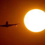 FILE – A Boeing 747 takes off from the airport in Frankfurt, Germany, on Aug. 7, 2020. Airplanes are a minor contributor to global greenhouse-gas emissions, but their share is sure to grow as more people travel in coming years, and that has the aviation industry facing the prospect of tighter environmental regulations and higher costs. At the opening of a huge aviation industry show near London, on Monday, July 18, 2022, discussion about climate change replaced much of the usual buzz over big airplane orders. (AP Photo/Michael Probst, File)
