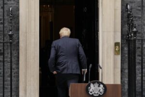 FILE – Prime Minister Boris Johnson enters 10 Downing Street, after his reading a resignation statement in London, July 7, 2022. Outgoing U.K. Prime Minister Boris Johnson has been the bane of Brussels for many years, from his days stoking anti-European Union sentiment with exaggerated newspaper stories to his populist campaign leading Britain out of the bloc and reneging on the post-Brexit trade deal he himself signed. (AP Photo/Alberto Pezzali, file)