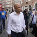 Conservative Member of Parliament Sajid Javid, one of the contenders to be the new leader of Britain’s ruling Conservative Party, leaves after a press conference in London, Monday, July 11, 2022. Candidates to replace Boris Johnson as Britain’s prime minister are scattering tax-cutting promises to their Conservative Party electorate, as party officials prepare Monday to quickly narrow the crowded field of more than ten candidates. (AP Photo/Frank Augstein)