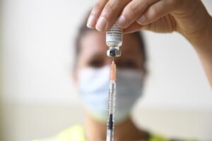FILE – A health professional prepares a dose of a Monkeypox vaccine at the Edison municipal vaccination centre in Paris Wednesday July 27, 2022. Public health officials warn that moves by rich countries to buy large quantities of monkeypox vaccine, while declining to share doses with Africa, could leave millions of people unprotected against a more dangerous version of the disease and risk continued spillovers of the virus into humans. (Alain Jocard, Pool via AP, FIle)
