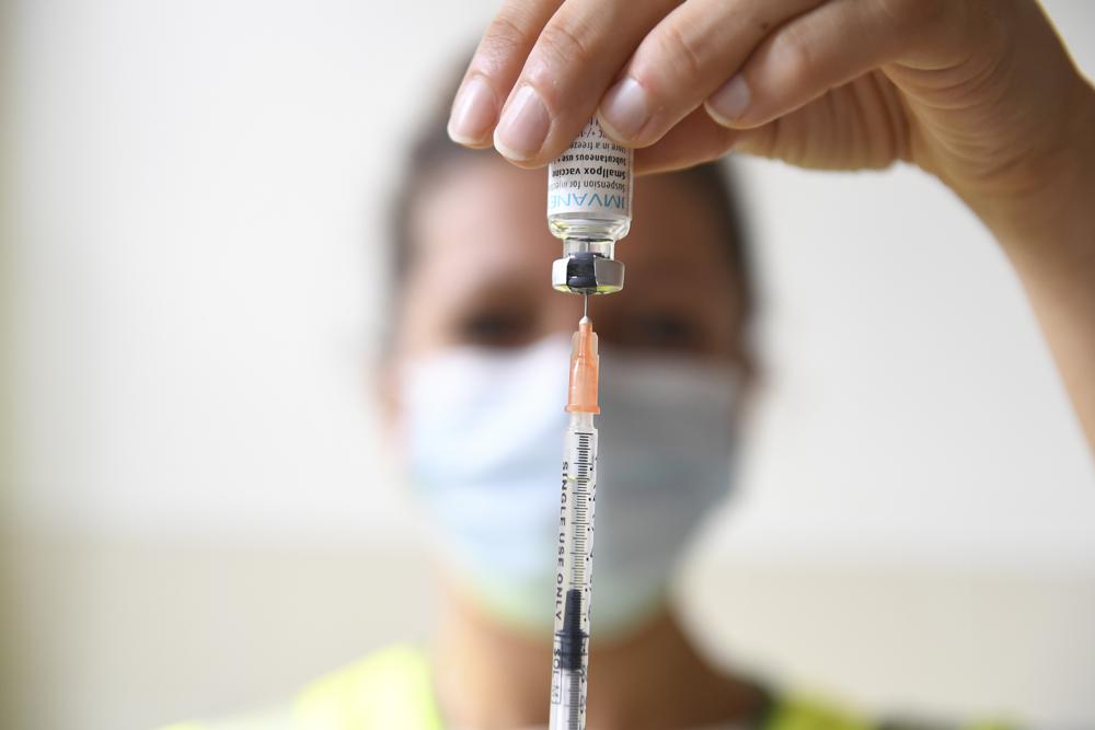 FILE – A health professional prepares a dose of a Monkeypox vaccine at the Edison municipal vaccination centre in Paris Wednesday July 27, 2022. Public health officials warn that moves by rich countries to buy large quantities of monkeypox vaccine, while declining to share doses with Africa, could leave millions of people unprotected against a more dangerous version of the disease and risk continued spillovers of the virus into humans. (Alain Jocard, Pool via AP, FIle)