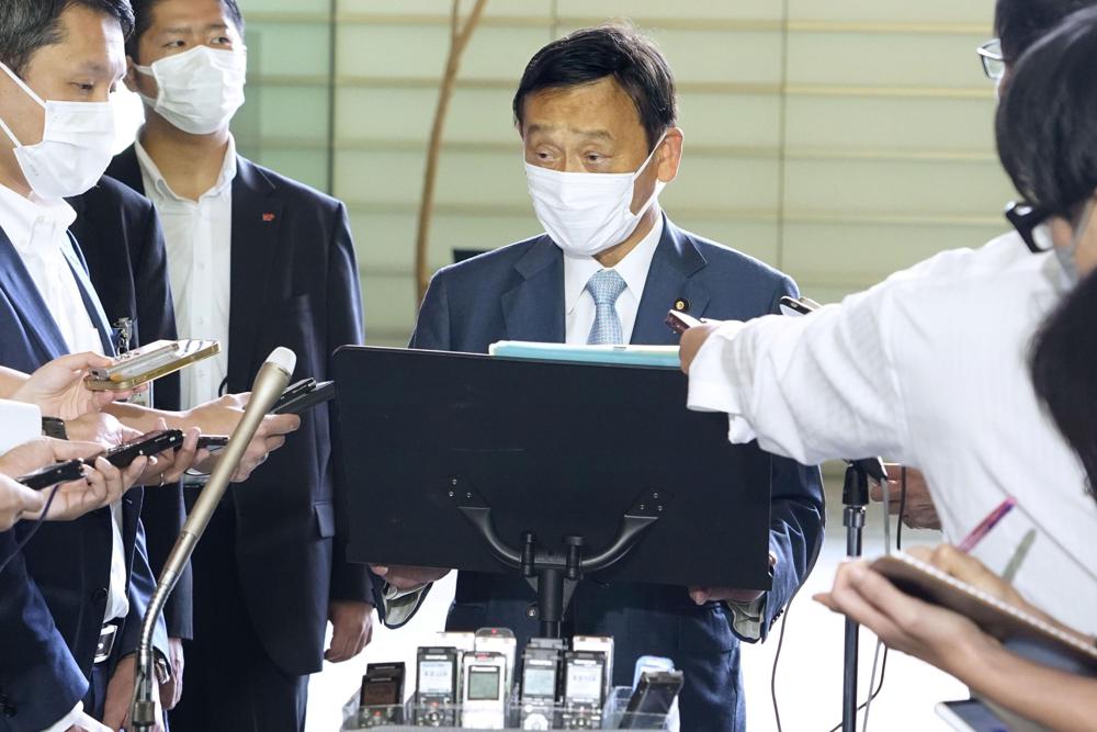 Shinsuke Suematsu, the Japanese Minister of Education, Culture, Sports, Science and Technology, speaks to reporters at the prime minister’s office in Tokyo, Thursday, July 28, 2022. Japan’s push to register a controversial former gold mine on Sado Island for a UNESCO World Heritage list is now being delayed because of insufficiency in the application, officials said. (Kyodo News via AP)