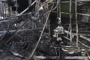 EDS NOTE: GRAPHIC CONTENT – A burned out body of Ukrainian military prisoner is seen in destroyed barrack at a prison in Olenivka, in an area controlled by Russian-backed separatist forces, eastern Ukraine, Friday, July 29, 2022. Russia and Ukraine accused each other Friday of shelling the prison in Olenivka in a separatist region of eastern Ukraine, an attack that reportedly killed dozens of Ukrainian military prisoners who were captured after the fall of a southern port city of Mariupol in May. (AP Photo)