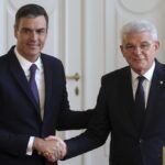 Spanish Prime Minister Pedro Sanchez, left, shakes hands with the member of the Bosnian presidency Sefik Dzaferovic after a press conference in Sarajevo, Bosnia, Saturday, July 30, 2022. (AP Photo/Armin Durgut)