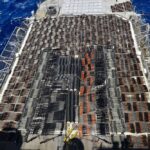 FILE – Weapons that the U.S. Navy described as coming from a hidden arms shipment aboard a stateless dhow are seen aboard the guided-missile cruiser USS Monterey, May 8, 2021. The U.S. Navy’s Mideast-based 5th Fleet will begin Tuesday, July 5, 2022, to offer rewards for information that could help sailors intercept weapons, drugs and other illicit shipments across the region. The program launches against the backdrop of tensions over Iran’s nuclear program and Tehran’s arming of Yemen’s Houthi rebels. (U.S. Navy via AP, File)