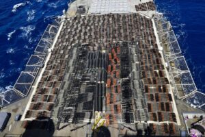 FILE – Weapons that the U.S. Navy described as coming from a hidden arms shipment aboard a stateless dhow are seen aboard the guided-missile cruiser USS Monterey, May 8, 2021. The U.S. Navy’s Mideast-based 5th Fleet will begin Tuesday, July 5, 2022, to offer rewards for information that could help sailors intercept weapons, drugs and other illicit shipments across the region. The program launches against the backdrop of tensions over Iran’s nuclear program and Tehran’s arming of Yemen’s Houthi rebels. (U.S. Navy via AP, File)