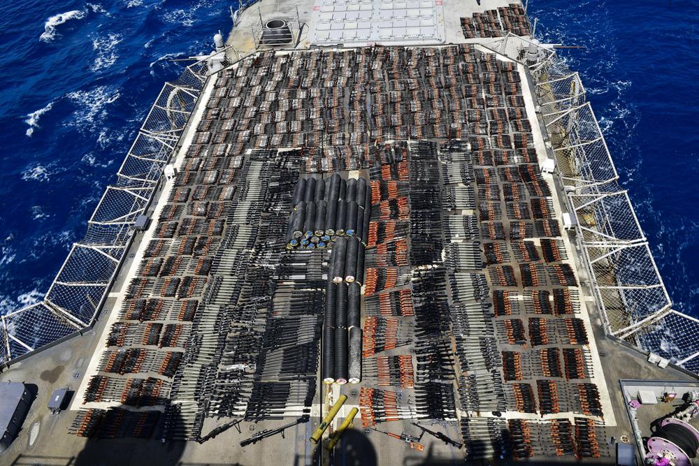FILE – Weapons that the U.S. Navy described as coming from a hidden arms shipment aboard a stateless dhow are seen aboard the guided-missile cruiser USS Monterey, May 8, 2021. The U.S. Navy’s Mideast-based 5th Fleet will begin Tuesday, July 5, 2022, to offer rewards for information that could help sailors intercept weapons, drugs and other illicit shipments across the region. The program launches against the backdrop of tensions over Iran’s nuclear program and Tehran’s arming of Yemen’s Houthi rebels. (U.S. Navy via AP, File)