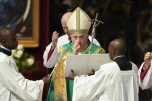 Pope Francis delivers his blessing at the end of a mass for the Congolese community he presided in St. Peter’s Basilica, at the Vatican, Sunday, July 3, 2022. (AP Photo/Andrew Medichini)