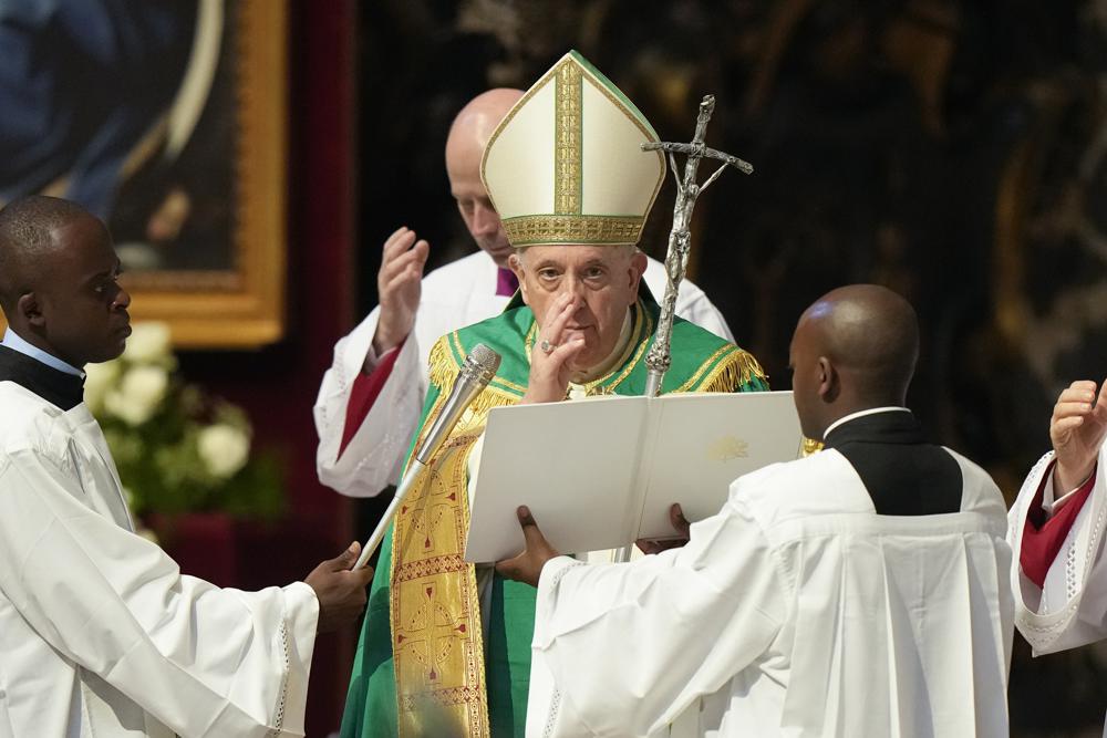 Pope Francis delivers his blessing at the end of a mass for the Congolese community he presided in St. Peter’s Basilica, at the Vatican, Sunday, July 3, 2022. (AP Photo/Andrew Medichini)