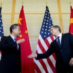 U.S. Secretary of State Antony Blinken, right, shakes hands with China’s Foreign Minister Wang Yi during a meeting in Nusa Dua on the Indonesian resort island of Bali Saturday, July 9, 2022. (Stefani Reynolds/Pool Photo via AP)