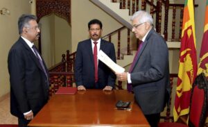 In this photograph provided by the Sri Lankan President’s Office, Ranil Wickremesinghe takes oath as the interim President in Colombo, Sri Lanka, Friday, July 15, 2022. Prime Minister Wickremesinghe was sworn in as Sri Lanka’s interim president Friday until Parliament elects a successor to Gotabaya Rajapaksa, who resigned after mass protests over the country’s economic collapse forced him from office. (Sri Lankan President’s Office via AP)