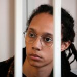 WNBA star and two-time Olympic gold medalist Brittney Griner sits in a cage at a court room prior to a hearing, in Khimki , outside Moscow, Russia, July 27, 2022. Alexander Zemlianichenko/Pool via REUTERS