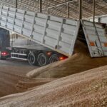 An employee unloads wheat grains inside a storage, as Russia’s attack on Ukraine continues, Zaporizhzhia region, Ukraine July 29, 2022. REUTERS/Dmytro Smolienko