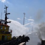 Firefighters work at a site of a Russian missile strike in a sea port of Odesa, as Russia’s attack on Ukraine continues, Ukraine, July 23, 2022.